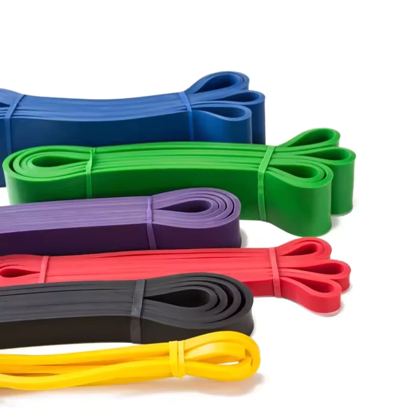 Set of colorful resistance bands on a white background