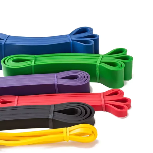 Set of colorful resistance bands on a white background