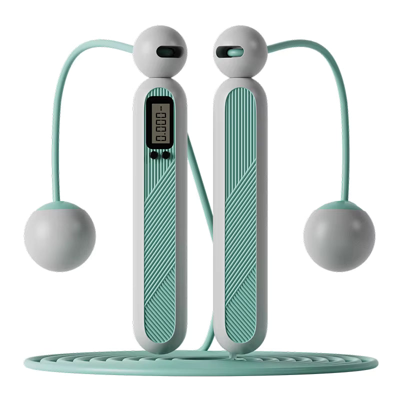 Pair of green and gray exercise jump ropes on a white background