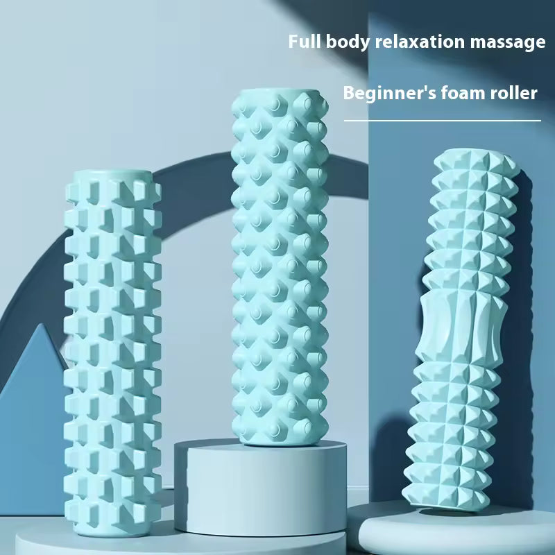 Three foam rollers with different textures on a blue background