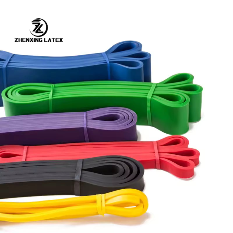 Set of colorful resistance bands with Zhenxing Latex logo on a white background